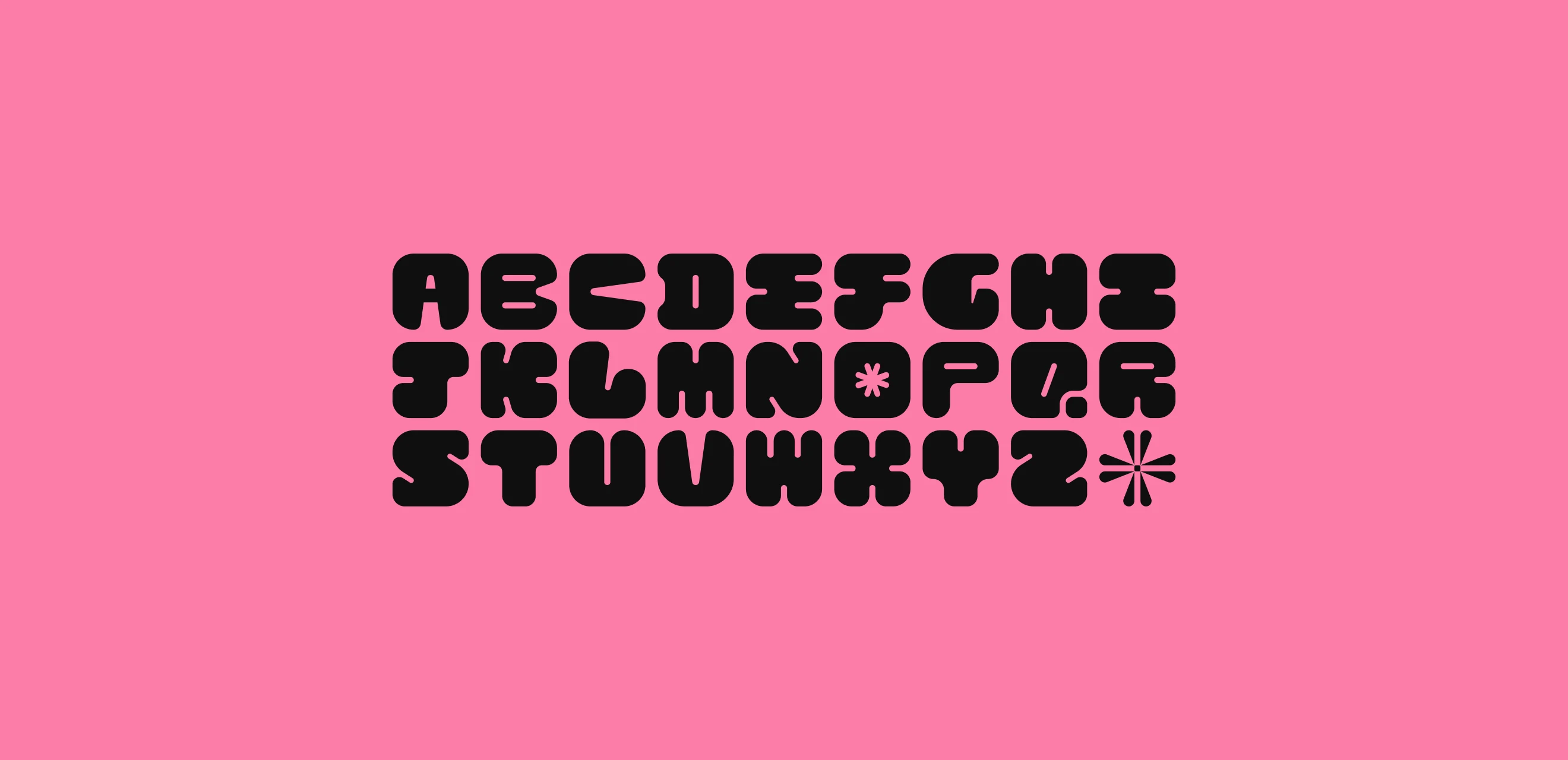 The rounded alphabet in black on hot pink, with an asterisk in place of a full stop